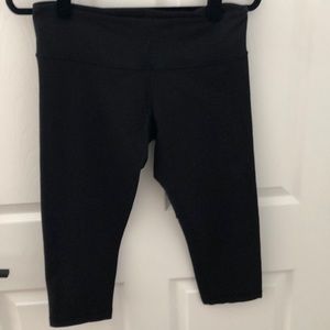 Black Lululemon Wonder Under crops.